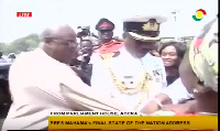 The woman preventing President Mahama from entering his car