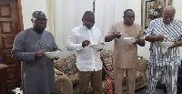 Leading members of the NDC enjoying a bowl of soup