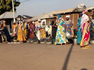 Traders on transacting business on the roads of Wa