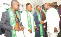 Dr. Raphael Nyarkotey Obu(President) 1st from Left, Hon. Buaben Asamoah shaking hands with executive