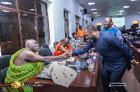 Dr. Mathew Opoku Prempeh showing courtesy to Okyehene