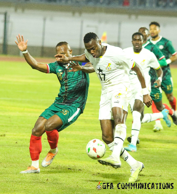 Patrick Kpodzo being tackled by Madagascar player