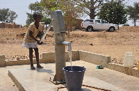 File photo: A child fetching water from a borehole using a waterpump