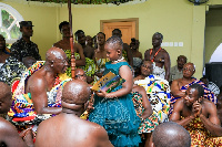 Rachel Yram presents her book to the Asantehene