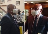 Minister Odongo arriving in parliament with electronic mask for vetting