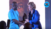 Kojo Oppong Nkrumah receiving his award at this year's MIGA