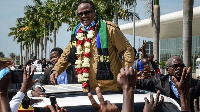 Lissu, reacts to supporters as he returns after three years in exile