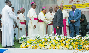 President Akufo-Addo greets Catholic priests at an event