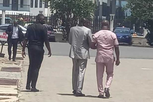 Pastor Love escorted from court