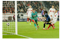 Ademola Lookman (3-R) of Atalanta scores the opening goal against goalkeeper Stuttgart