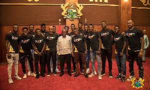 The Black Stars in a pose with President Akufo-Addo