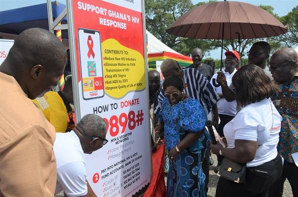 Mrs Akosua Fremah Opare (middle) with other dignitaries unveiling the Support Code