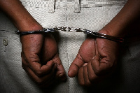 File photo of a person in handcuffs