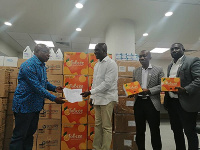 Mr Agyemang Manu (left) receiving the items from Mr Tobbin