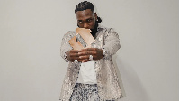 Burna Boy celebrates his latest history-making feat, topping the UK album chart