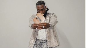 Burna Boy celebrates his latest history-making feat, topping the UK album chart