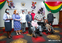 Vice President Mahamudu Bawumia assisted by the Minister of Health handed over the wheel chairs