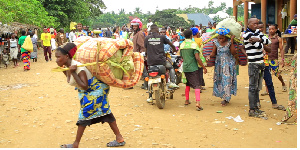 Some of the Congolese refugees with their property in Bundibugyo District on Wednesday.