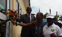 Minister of Lands and Natural Resources, Nii Osah Mills (in suit)