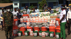 A photo of the AFSHTS headmaster, students and ActionPlus PRO during the donation