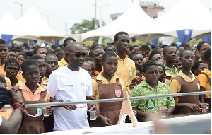 Managing Director of Unilever Ghana, Yeo Ziobeieton with some school children