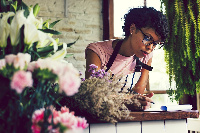 A black woman writing a letter to her ex-lover