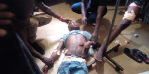 One of the persons who sustained injury surrounded by others