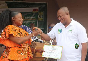 Mayor of Kumasi, Hon Samuel Pyne in a discussion with one of the participants