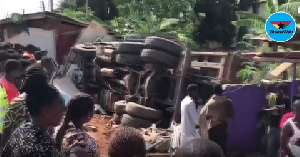 The driver was able to veer off the road but the truck overturned and crashed into the shops