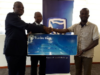 Mr Woyongo receiving his cash prize