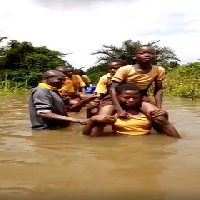 Children walking through the water