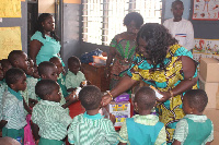 Sandra Owusu Ahenkorah interacting with some pupils of basic schools in her catchment area