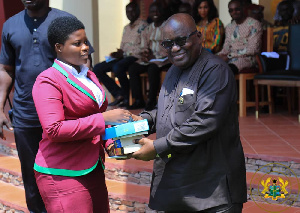 President Nana Addo Dankwa Akufo-Addo presenting an award to a student