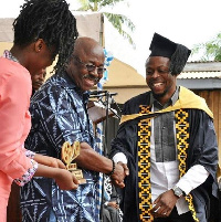 Kalybos receiving his award