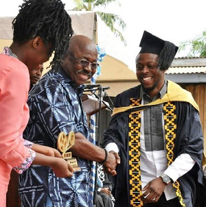 Kalybos receiving his award