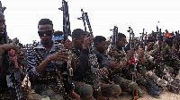 Military forces supporting anti-government opposition groups display their weapons in Mogadishu