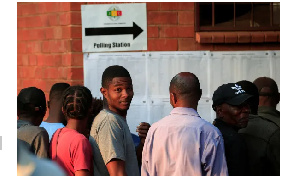 People queue to cast their vote at Kuwadzana school in Harare, Zimbabwe, on August 23