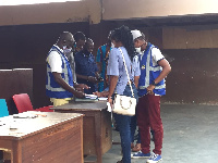 File Photo: Electoral officials at a polling station