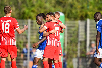 Daniel-Kofi (in 11 jersey) congratulated by a teammate