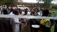 Hon. Kwasi Bonzo cutting the tape to the new staff bungalow