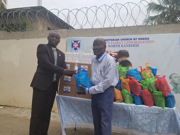 Rev. Dr. Joseph Kofi Antwi presenting the items on behalf of the church