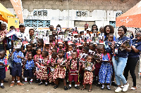 A section of the children with their teachers after receiving the items