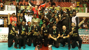 Malkia Strikers players celebrate with the trophy after beating Egypt