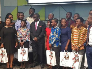 The beneficiaries in a group photograph with Ecobank MD, Mr Daniel Sackey