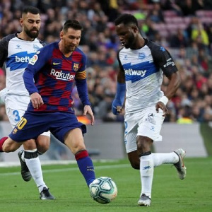 Wakaso in the tussle for the ball with Messi