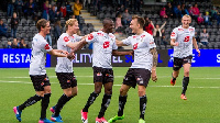 Gilbert Koomson celebrating with teammates