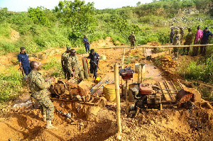 File photo: Officials of Operation Vanguard at an illegal concession