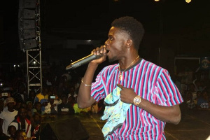 Kwame Eugene performing in front of the crowd