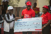 Officials of Barclays presenting a dummy cheque to the Vice Chancellor of University of Ghana