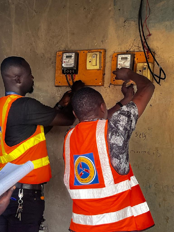 Some ECG workers disconnecting a meter - File photo